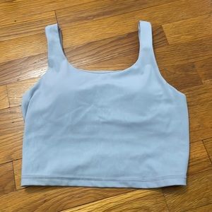 This is a cropped tank top with a built in bra.